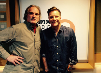 Looking big of body & small of head, Sid poses with a properly proportioned Deacon Blue's Ricky Ross at BBC Radio 2 in London, Nov. 17, 2014.