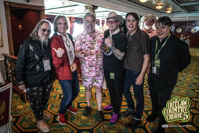 Dylan pal and former High Times editor Larry ‘Ratso’ Sloman, Our Hero, Mojo Nixon, three merry Long Ryders with Mojo’s manager Bullethead lurking suspiciously in the background on the SiriusXM Outlaw Country Cruise. Photo by Will Byington.